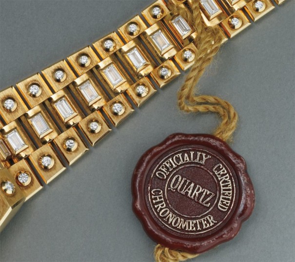 An extremely rare and flamboyant yellow gold and diamond-set calendar wristwatch with centre seconds, diamond-set "Octopussy" bracelet and wood dial